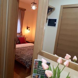 Postel nebo postele na pokoji v ubytování Tara Apartmani Malešević - 3 lux