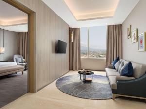 Ένα ή περισσότερα κρεβάτια σε δωμάτιο στο Radisson Lampung Kedaton