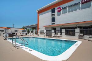 a large swimming pool in front of a building at Best Western Plus Panama City Hotel in Panama City