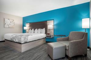 a hotel room with a bed and a chair at Best Western Plus Panama City Hotel in Panama City +21 photos