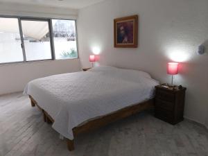 Postel nebo postele na pokoji v ubytování casa HIKURI