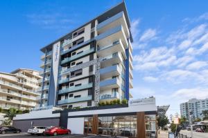a large building with a lot of windows at Direct Hotels - Sea Breeze Mooloolaba in Mooloolaba