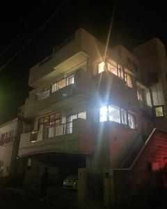 a building at night with the lights on at Marina Bay Atami in Atami