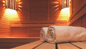 a room with a wooden floor and a wooden ceiling at Byron Palms Guesthouse & Spa - Adults Only in Byron Bay