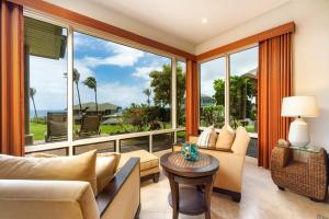 a living room filled with furniture and a large window at Kapalua Bay Villa 32G4 villa in Kahana