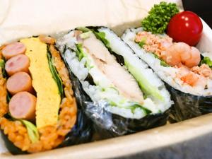 a sandwich with meat and vegetables on a plate at Green Rich Hotel Hiroshima Shinkansenguchi (Artificial hot spring Futamata Yunohana) in Hiroshima