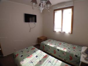 Posteľ alebo postele v izbe v ubytovaní Appartement Cavalaire-sur-Mer, 3 pièces, 4 personnes - FR-1-100-270