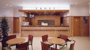 a room with two tables and chairs in a store at Toyoko Inn Hiroshima-eki Minami-guchi Migi in Hiroshima +29 photos