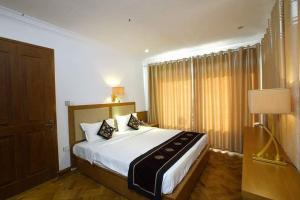 Cama o camas de una habitación en Great Wall Hotel - Mandalay