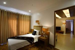 Cama o camas de una habitación en Great Wall Hotel - Mandalay