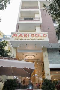 a building with a sign that reads marriot gold music and apartment therapy at Marigold Hotel & Apartment in Danang