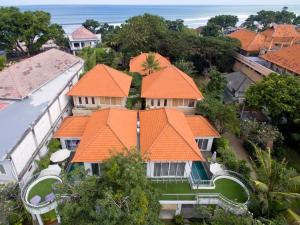 an aerial view of a house with orange roofs at 3BR Del Mar Beach Villas Near La Plancha Seminyak in Seminyak