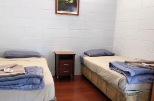Postel nebo postele na pokoji v ubytování Cooktown Motel