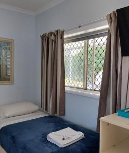 Postel nebo postele na pokoji v ubytování Cooktown Motel