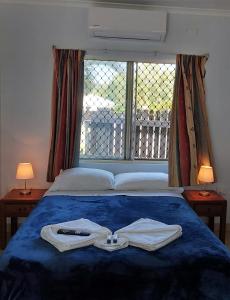 Postel nebo postele na pokoji v ubytování Cooktown Motel