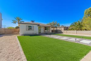 a house with a yard with green grass at 14th Coronado Historic District Phoenix home in Phoenix