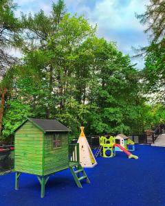 a playground with several different types of play equipment at H&R Polaris Szczawnica in Szczawnica