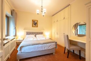 Postel nebo postele na pokoji v ubytování Apartament Hotel H