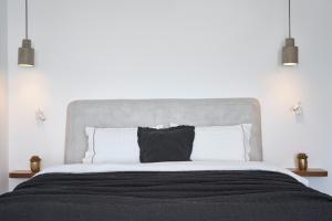 Apanemo Hotel & Suites房間的床