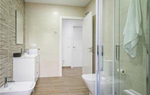 A bathroom at Awesome Home In Noia With Wifi