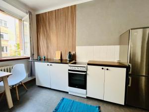 Kuchyňa alebo kuchynka v ubytovaní Apartament Blue Shell - Gdynia Centrum + 4 fotografie