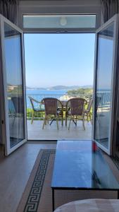 a view of a balcony with a table and chairs at Apartmani Matea in Zaton