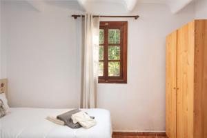 Postel nebo postele na pokoji v ubytování Sunset private Eco-Villa Can Vey