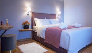 A bed or beds in a room at Apartments Gonies - Artemis
