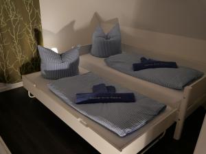 Llit o llits en una habitació de dicht an der Küste Haus "Emma" mit Infrarot-Sauna uWallbox