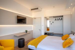 Posteľ alebo postele v izbe v ubytovaní Hotel Delfino