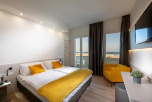 Posteľ alebo postele v izbe v ubytovaní Hotel Delfino