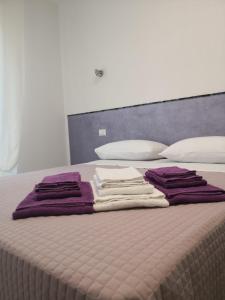 Posteľ alebo postele v izbe v ubytovaní Appartamenti Bellini