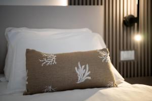Posteľ alebo postele v izbe v ubytovaní Hotel Delfino
