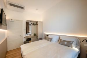 Posteľ alebo postele v izbe v ubytovaní Hotel Delfino