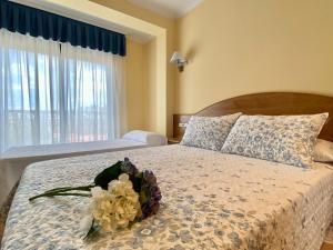 Tempat tidur dalam kamar di Duerming Areas Playa Hotel