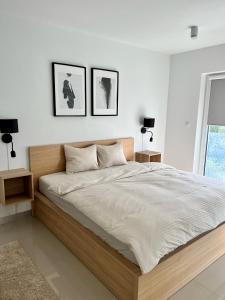 En eller flere senge i et værelse på Zielone Apartamenty Katowice Chorzów