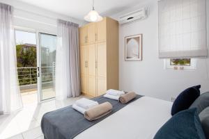 Krevet ili kreveti u jedinici u objektu Tersanas Seaside Apartment