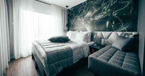 Postel nebo postele na pokoji v ubytování Hotel AX