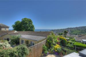 a view of a house with a garden at Sandpiper in Lyme Regis
