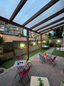 a patio with chairs and tables on a patio at B&B Family Room in Portici