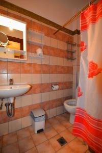 a bathroom with a sink and a toilet at VILLA Vasilios EXARHOS in Paralia Katerinis