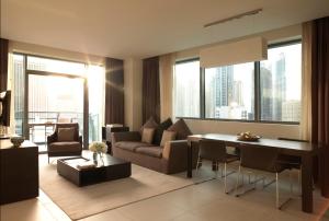 a living room filled with furniture and a window at Radisson Blu Residence, Dubai Marina in Dubai