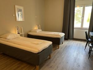 Postel nebo postele na pokoji v ubytování Sidsjö Hotell & Konferens
