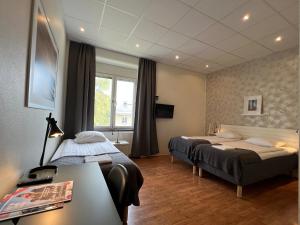 Postel nebo postele na pokoji v ubytování Sidsjö Hotell & Konferens