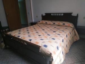 Letto o letti in una camera di B&B L'uva Fragolina