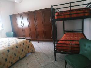 Letto o letti in una camera di B&B L'uva Fragolina