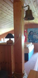 a bedroom with a bed and a lamp in a room at Haus Lenelies in Prerow