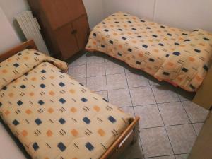 Letto o letti in una camera di B&B L'uva Fragolina