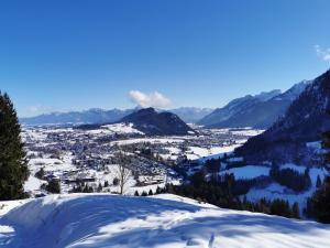 a view from the summit of a mountain in the snow at Sunrise Belvedere Pfronten in Pfronten