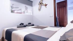 Postel nebo postele na pokoji v ubytování Apartamento Torrox Vibes Frente al Mar + 17 fotografií